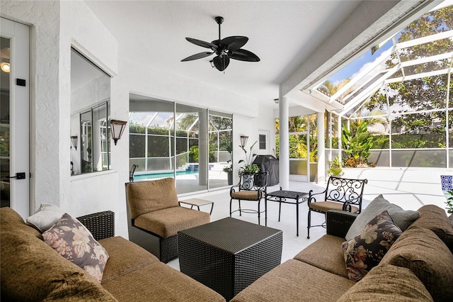 sunroom featuring ceiling fan