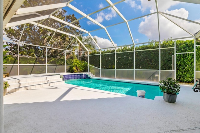 view of pool featuring a lanai and a patio