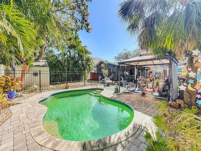 view of swimming pool with a gazebo and a patio area