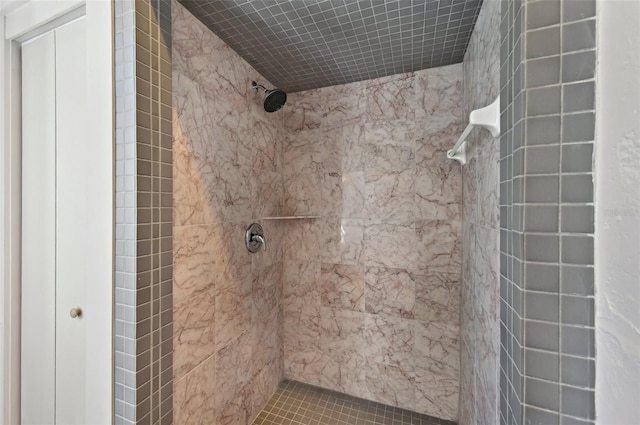 full bath featuring a tile shower