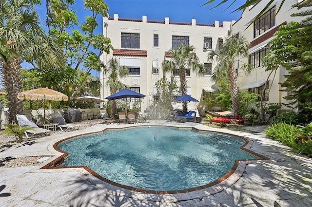 view of swimming pool with a patio