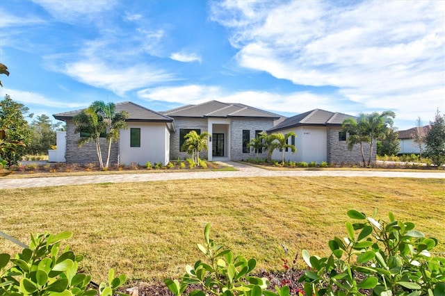 ranch-style home with a front lawn