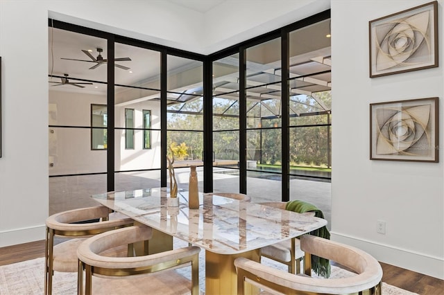 dining area with hardwood / wood-style flooring and ceiling fan