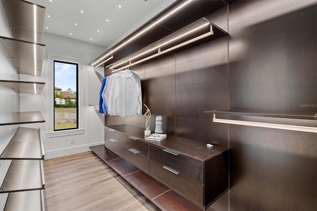 spacious closet featuring light hardwood / wood-style flooring