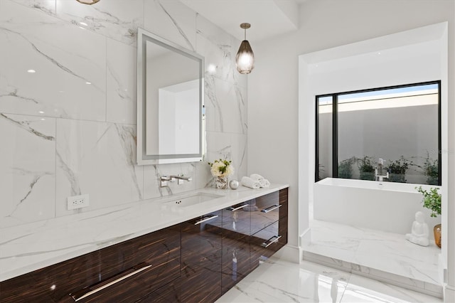 bathroom with a tub to relax in and vanity