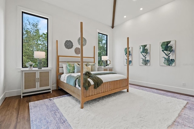 bedroom featuring lofted ceiling and dark wood-type flooring