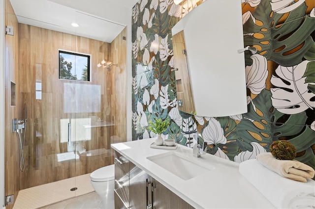 bathroom with vanity, tile patterned floors, a shower, and toilet