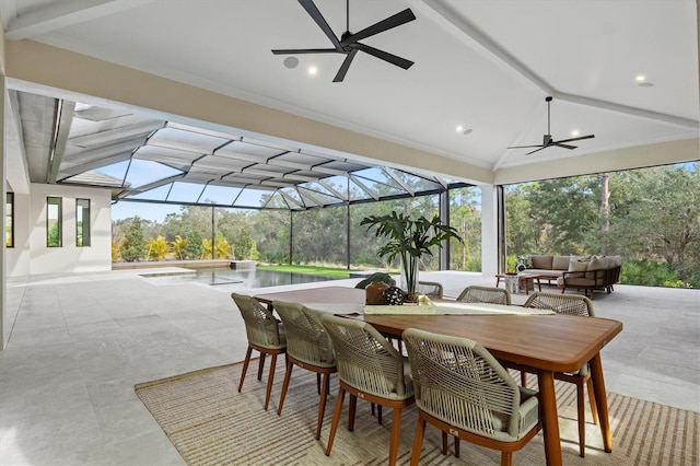 view of patio with ceiling fan, outdoor lounge area, and glass enclosure