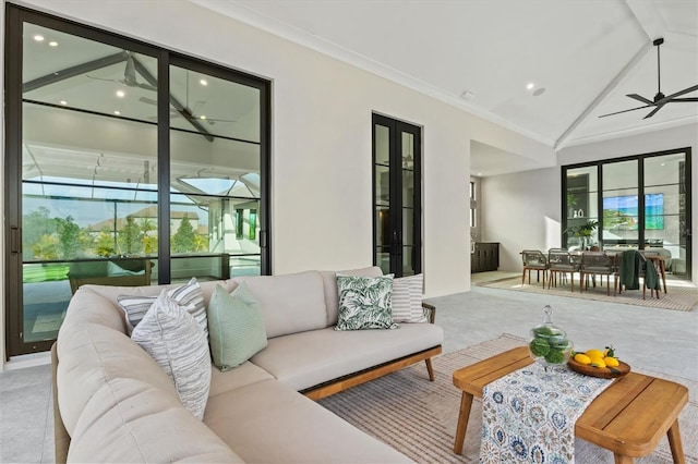 carpeted living room featuring ceiling fan, lofted ceiling, ornamental molding, and a wealth of natural light