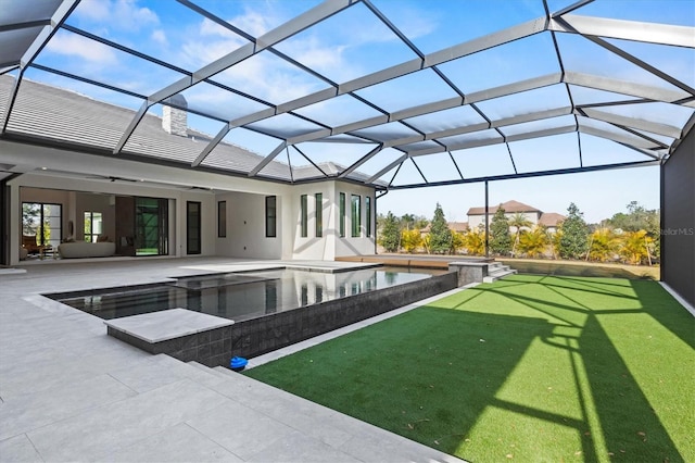 view of swimming pool featuring ceiling fan, a yard, a lanai, and a patio area