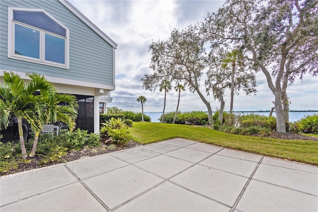 view of patio featuring a water view