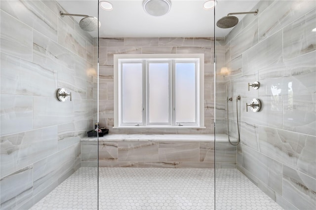 bathroom with tiled shower