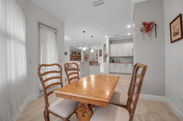 dining area featuring ornamental molding