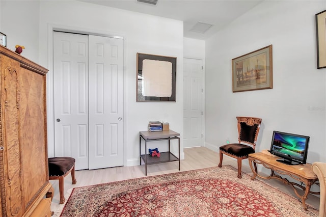 sitting room with light hardwood / wood-style floors