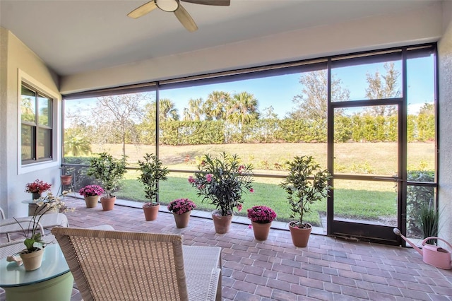 sunroom with ceiling fan and plenty of natural light