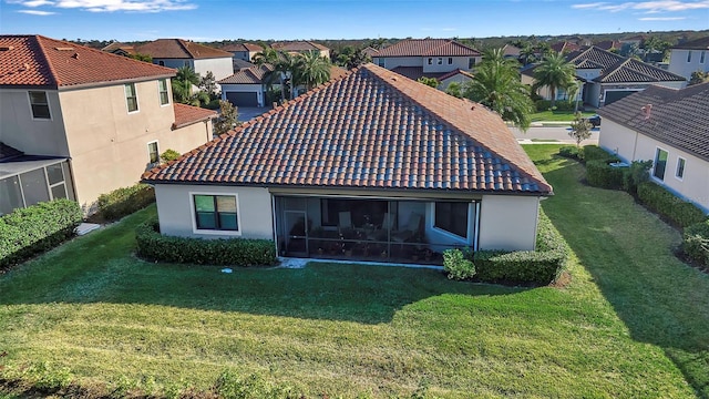 rear view of house with a lawn