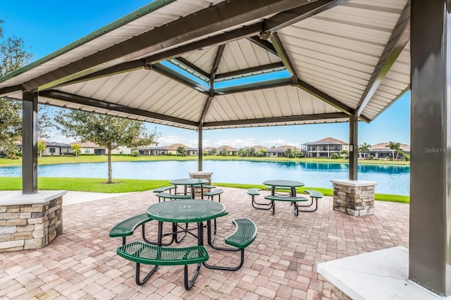 view of patio / terrace with a gazebo and a water view