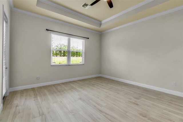 13303 Swiftwater Way, Lakewood Ranch, FL 34211 - unfurnished bedroom with a raised ceiling, crown molding, light wood finished floors, baseboards, and ceiling fan