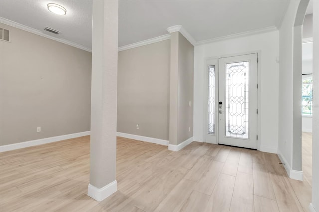 13303 Swiftwater Way, Lakewood Ranch, FL 34211 - entrance foyer featuring light wood-style flooring, ornamental molding, arched walkways, and baseboards