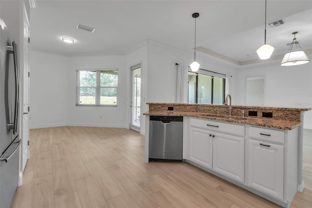 13303 Swiftwater Way, Lakewood Ranch, FL 34211 - kitchen featuring stainless steel appliances, a sink, stone countertops, white cabinets, and light wood-type flooring