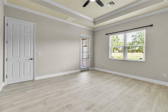 13303 Swiftwater Way, Lakewood Ranch, FL 34211 - spare room with light wood finished floors, a raised ceiling, a ceiling fan, ornamental molding, and baseboards