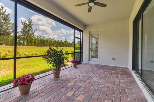 13303 Swiftwater Way, Lakewood Ranch, FL 34211 - unfurnished sunroom with a ceiling fan