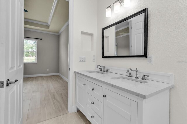 13303 Swiftwater Way, Lakewood Ranch, FL 34211 - full bath with double vanity, crown molding, and baseboards