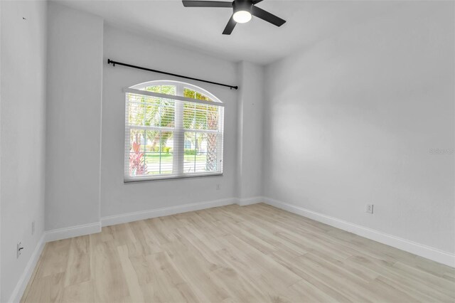 13303 Swiftwater Way, Lakewood Ranch, FL 34211 - spare room featuring light wood-type flooring, ceiling fan, and baseboards