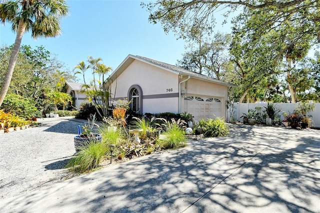 view of side of home featuring a garage