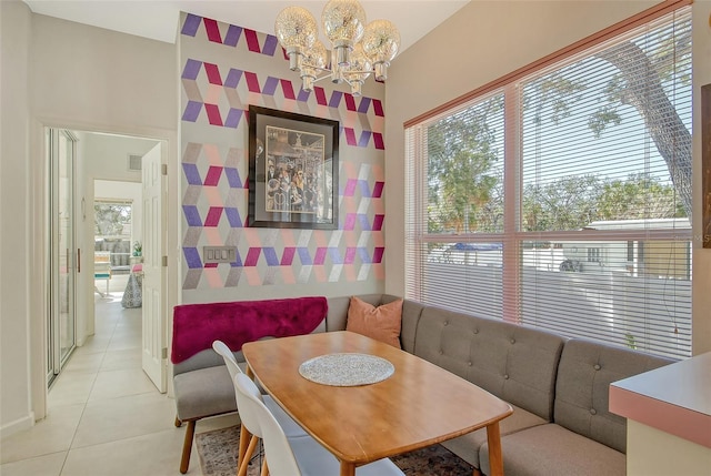 tiled dining area with a notable chandelier