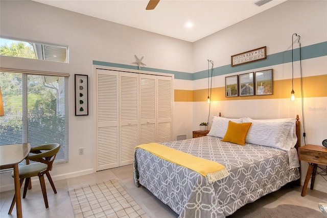 bedroom with ceiling fan and a closet