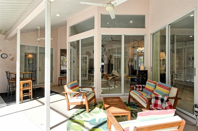 sunroom / solarium featuring vaulted ceiling with beams and ceiling fan