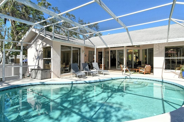 view of pool with a lanai and a patio area