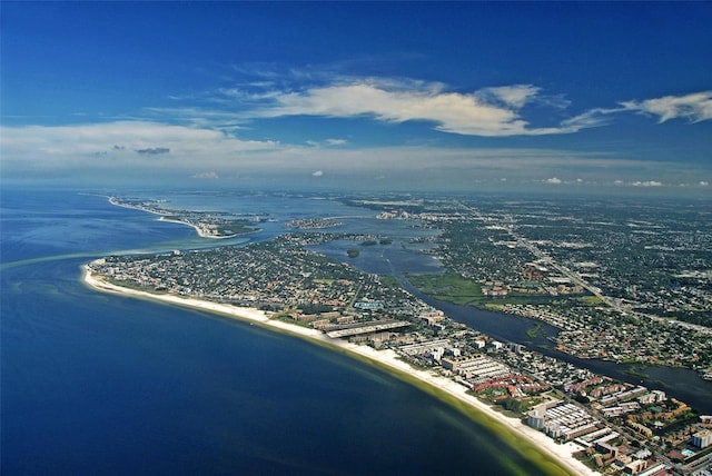 birds eye view of property featuring a water view and a beach view