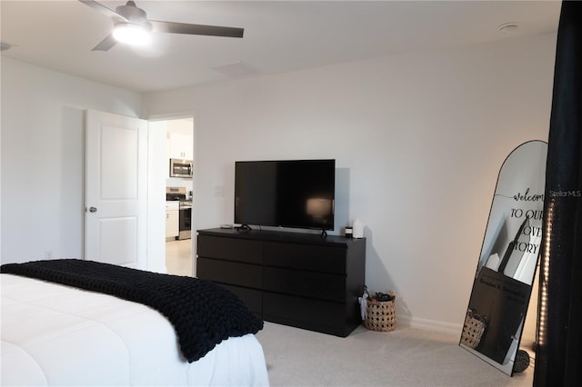 bedroom featuring light carpet, visible vents, and a ceiling fan