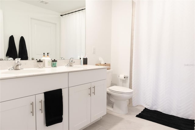 full bath with double vanity, tile patterned flooring, a sink, and visible vents