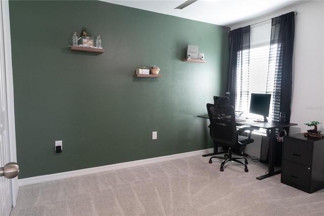 office featuring light carpet and baseboards