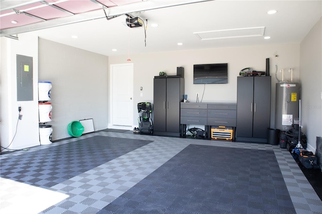 garage with recessed lighting, electric panel, a garage door opener, and electric water heater