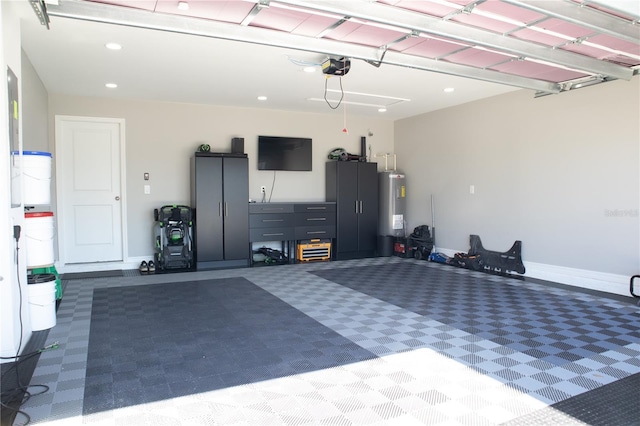 garage with water heater, a garage door opener, baseboards, and recessed lighting