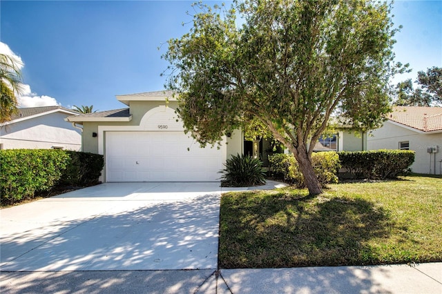 view of front of property featuring a garage and a front lawn