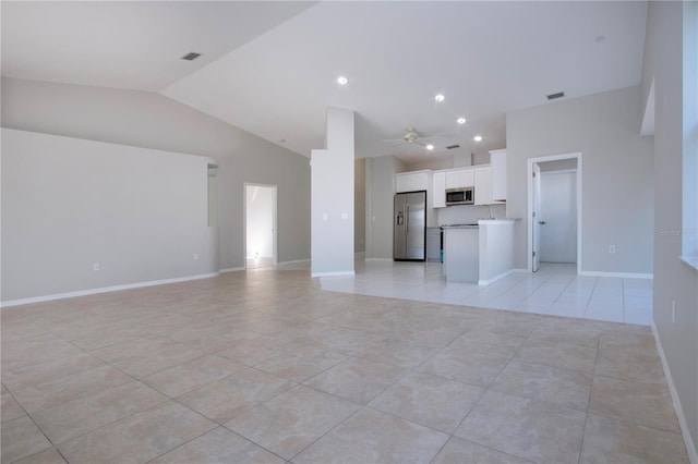 unfurnished living room with light tile patterned floors, high vaulted ceiling, and ceiling fan