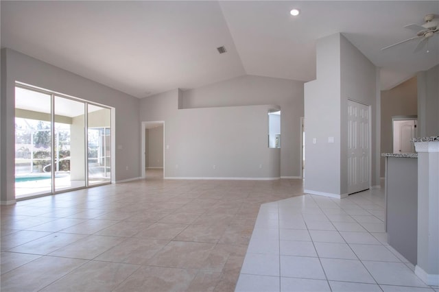 unfurnished living room with light tile patterned flooring, lofted ceiling, and ceiling fan