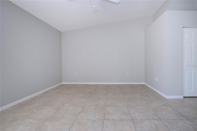 additional living space with ceiling fan and light tile patterned floors