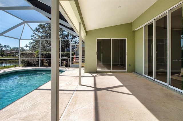 view of swimming pool featuring a lanai, a water view, and a patio area