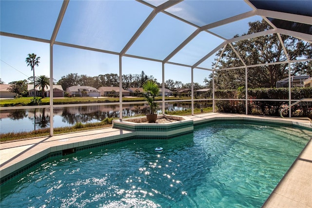 view of swimming pool with a water view and a lanai