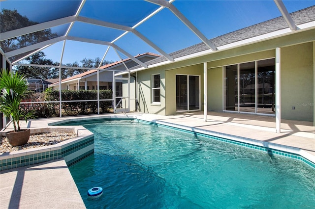 view of pool with a lanai and a patio area