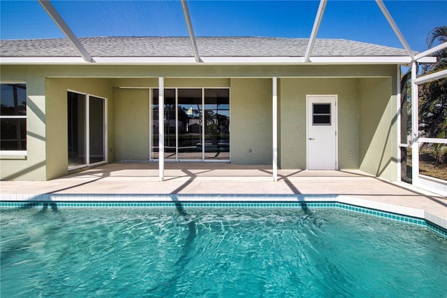 view of swimming pool with a lanai