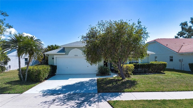 view of front of home featuring a garage and a front lawn