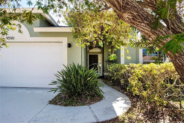 view of exterior entry featuring a garage