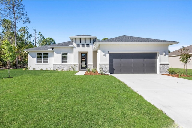 prairie-style home with a garage and a front yard